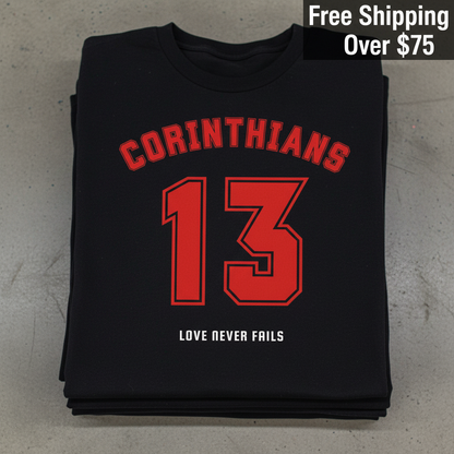 Corinthians 13 Love Never Fails T-Shirt_stacked_flatlay